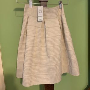 NWT bebe cream skirt size XS